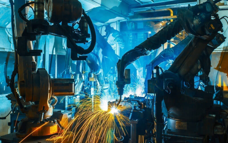Robotic arms working on a assembly line creating sparks